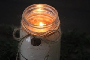 mason jar with a candle inside